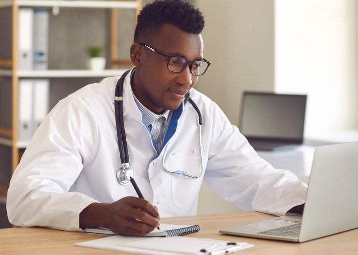 Doctor reviewing information at a computer